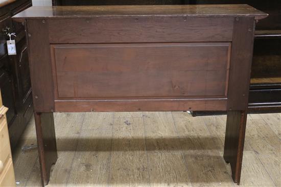 An early 20th century Arts & Crafts oak two door cupboard W.101cm